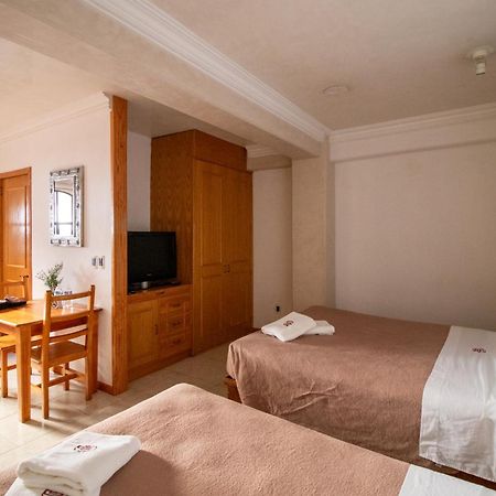 Suites Sevilla بويبلا المظهر الخارجي الصورة